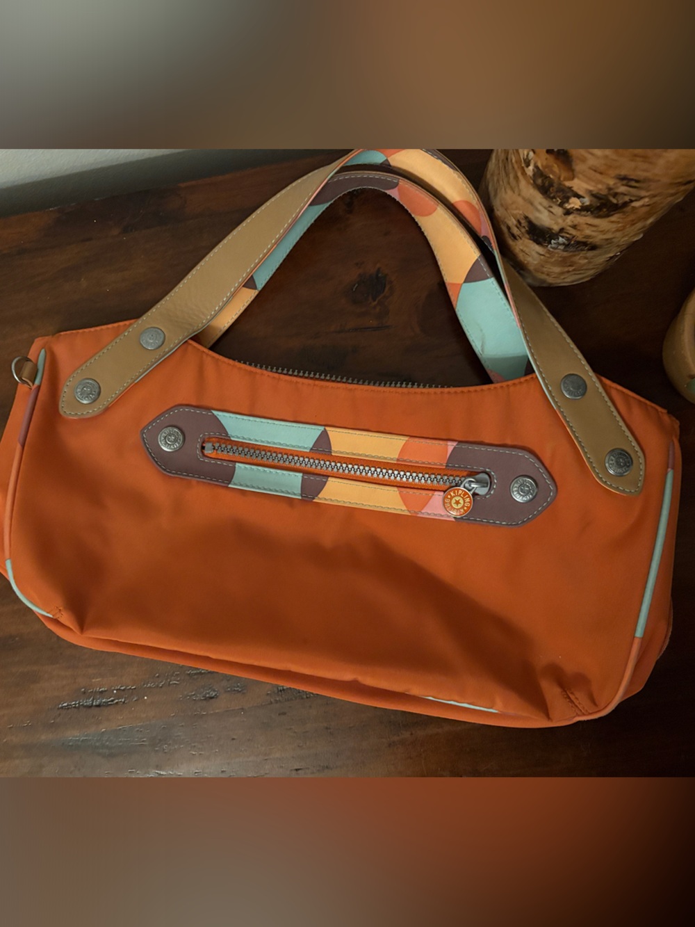 Kipling Women’s Orange Sling Bag with Multicolor Accent Strap